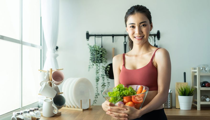 woman holding salad bowl